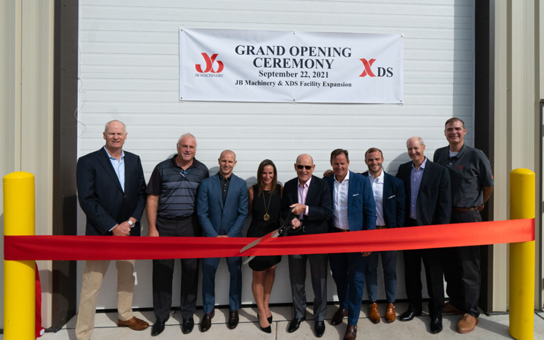 JB Leadership Team cuts the ribbon at the Grand Opening of the expanded XDS manufacturing facility